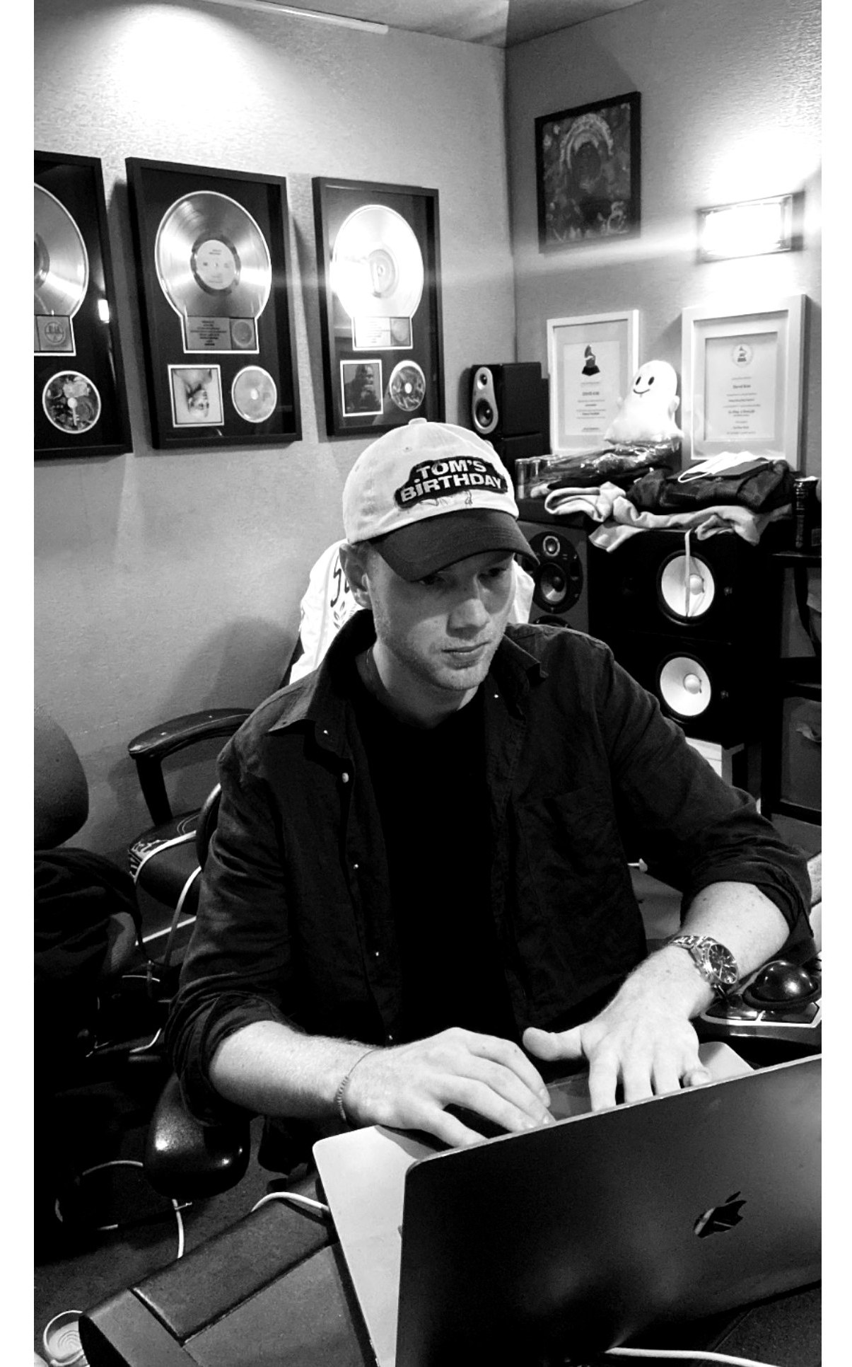 ØSTMOE working at Chalice Recording Studios with record plaques on the wall